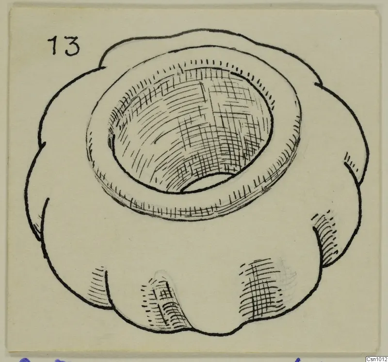 Ink drawing of a stone macehead with a lobed outer edge and a deep central hole.
