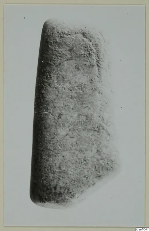 Thick grey stone object with a rough surface, small find from Lapithos, Vrysi tou Barba tombs