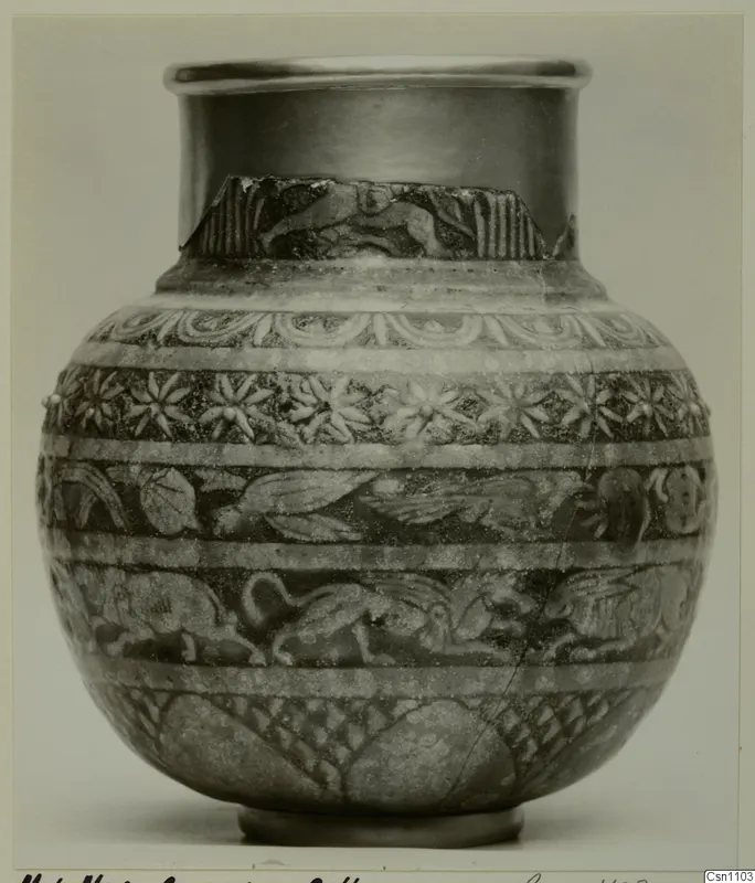 Globular pot with a flared rim, decorated with bands of relief animals and rosettes
