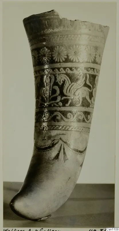 Faience pot with bands of rosettes, scrolls and a winged animal, shown against a plain background.