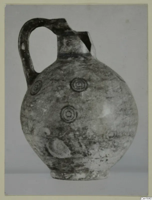 Round-bodied jug with a strap handle and concentric circle motifs, from Marion, Tomb 12