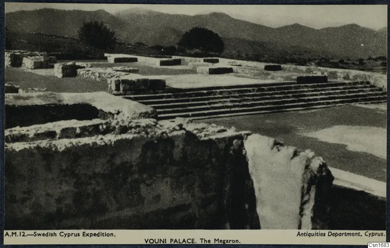 Ruined megaron at Vouni Palace with a flight of stone steps and mountains behind