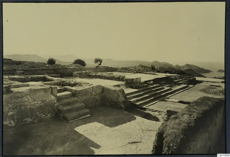 Stone staircase and walls among the ruins at Vouni palace, with hills and sea beyond