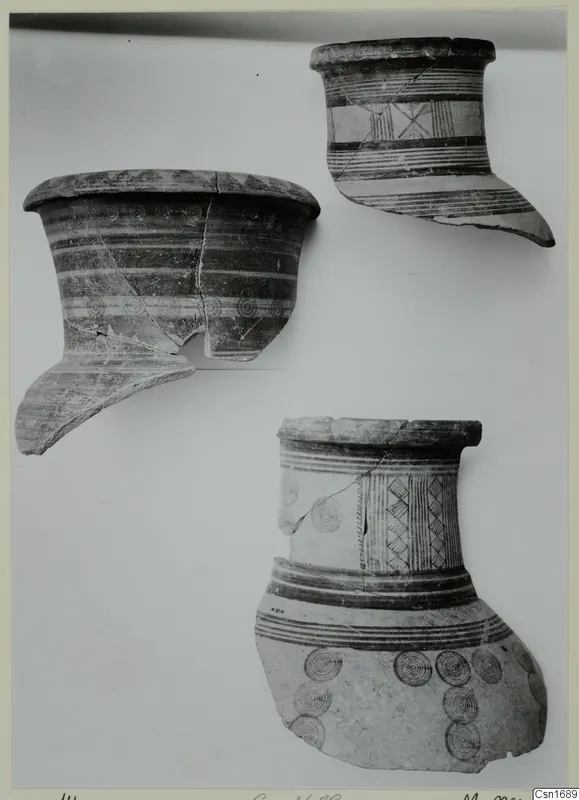 Three fragments of painted pottery vessels from Marion, with bands and concentric circle motifs