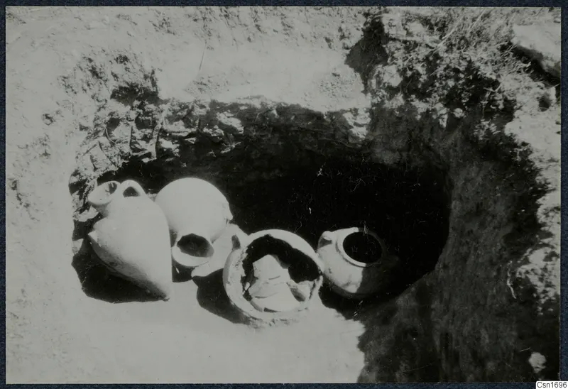 Tomb 94 at Marion during excavation, with pottery vessels lying in situ in the cut opening
