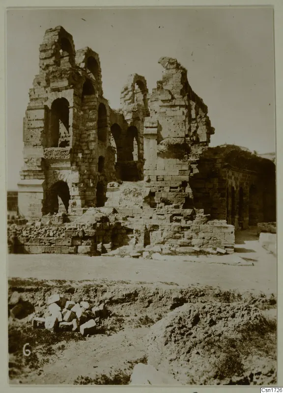 Ruined stone and brick building with arched openings and broken walls, North Africa