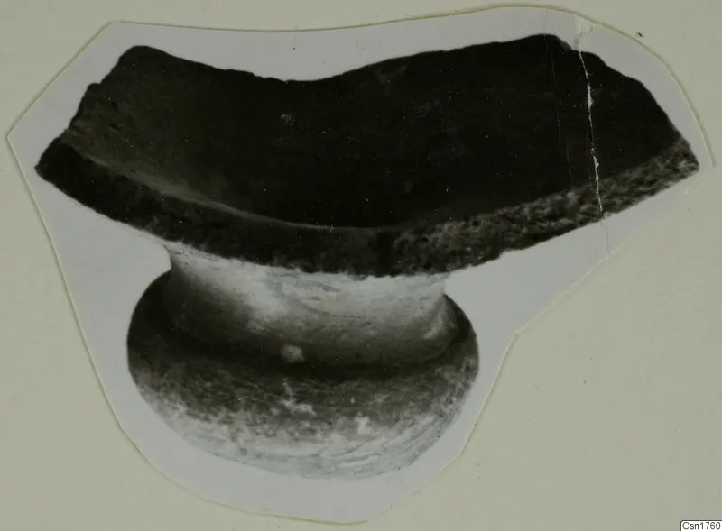 Pottery sherd with a broken rim and a short stem, cut out and mounted on a pale card