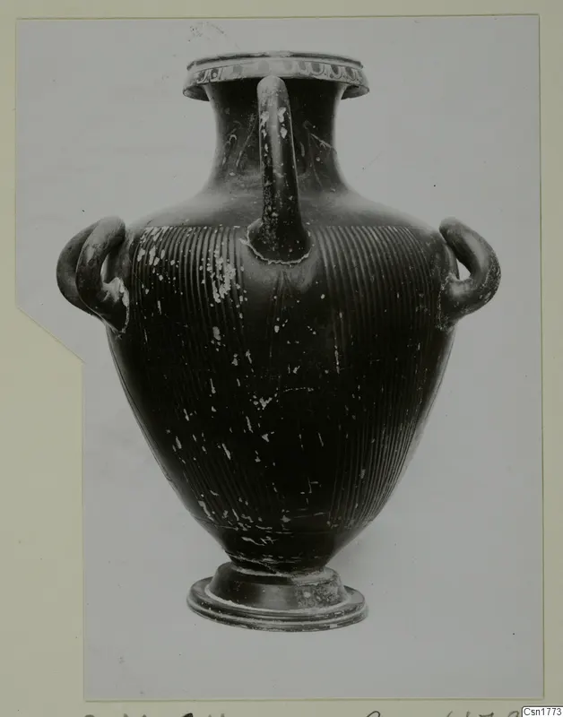 Black-glazed vessel with three handles and a grooved lower body.