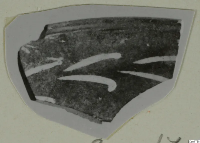 Pottery sherd with curved white painted strokes on a dark surface, Cypro-Hell. II