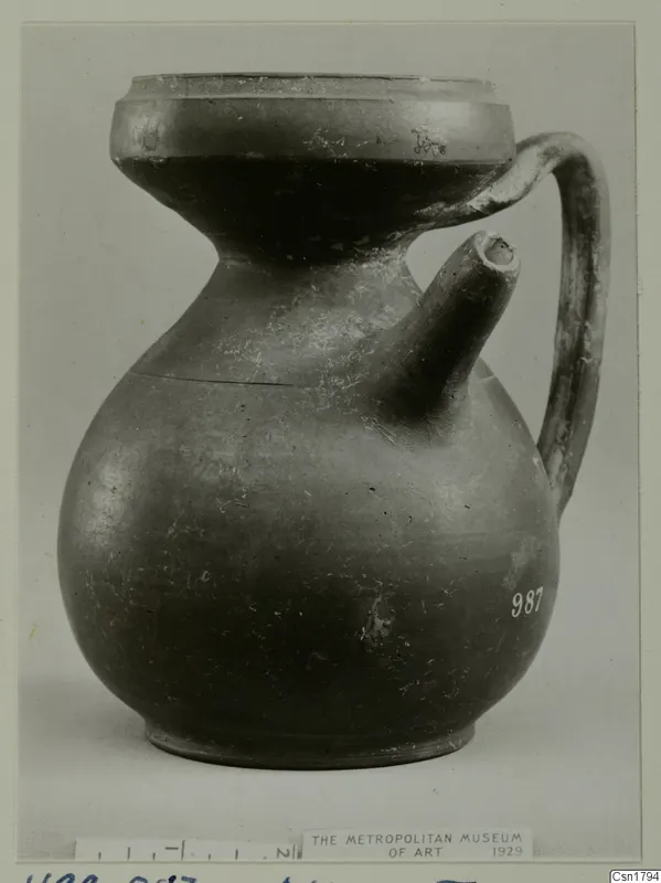 Cypro-Hell. II jar with a side spout and strap handle, seen from the side