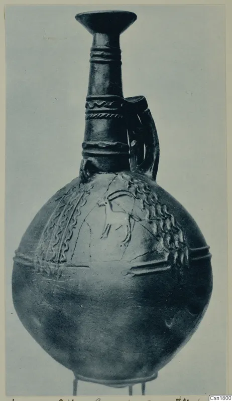 Red Polished III jug from Vounous with a round body, flaring neck and incised animal motif on the shoulder