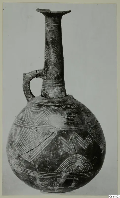 Red Polished III jug from Lapithos with a tall neck, single strap handle and linear patterns of arcs and chevrons on the body