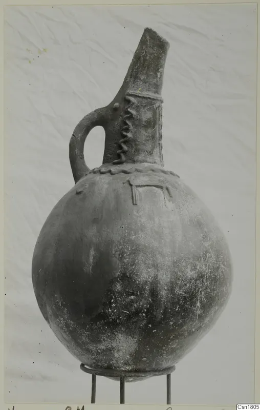 Round-bodied jug with a tall neck and strap handle, from Vounous (Red Polished III)