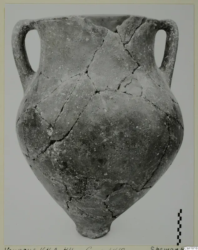 Red Polished I pottery vessel from Vounous, with two loop handles and a narrow base.