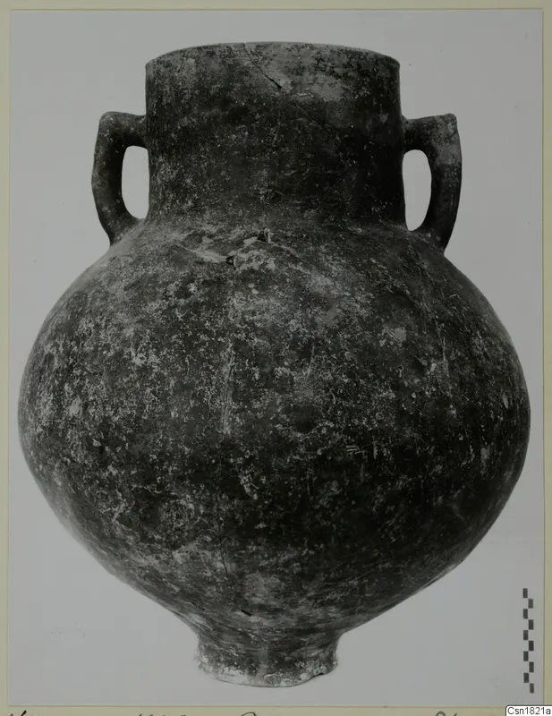 Red Polished I pottery vessel with two loop handles, from Vounous, photographed against a pale background