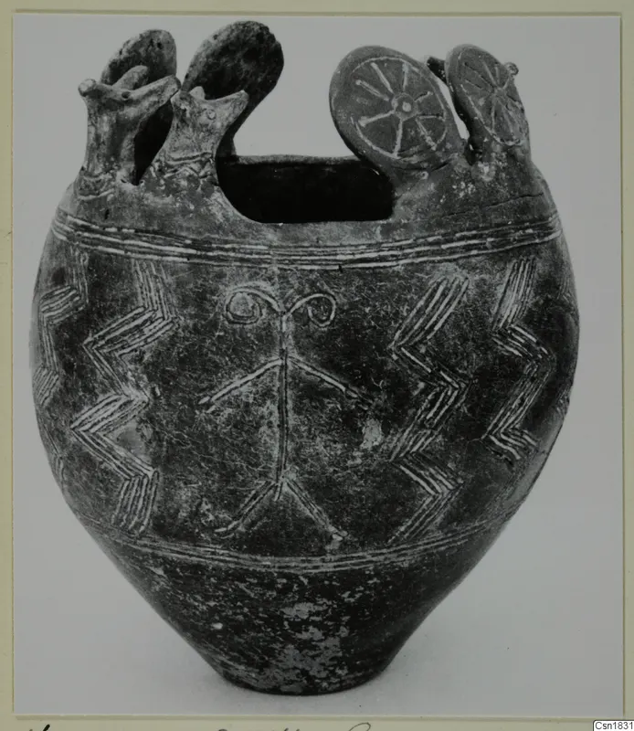 Pottery vessel with incised chevron and band patterns, a wide top opening and disc-shaped knobs with spokes on the rim