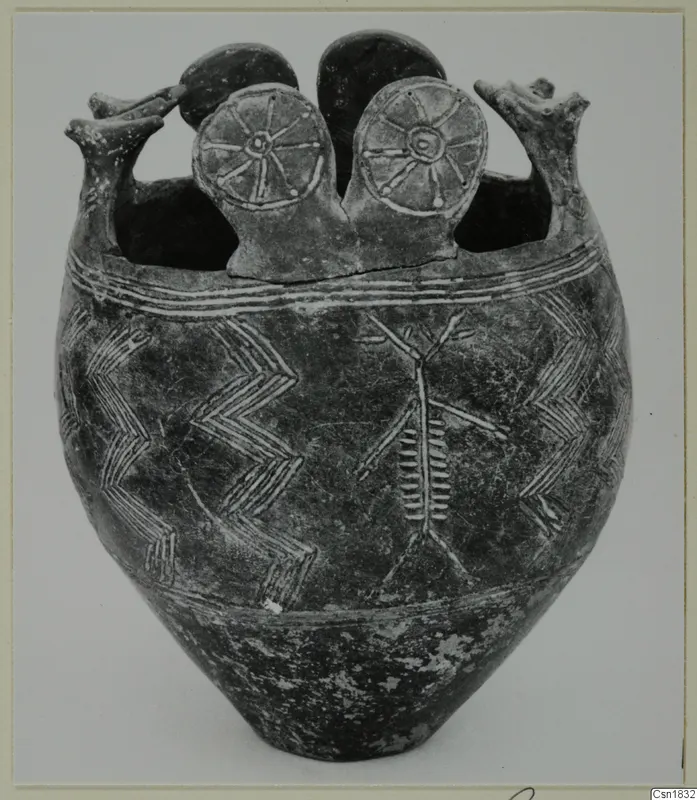 Pottery Red Polished I vessel with white-painted chevrons and a branched motif, with spoked discs and upright projections on the rim