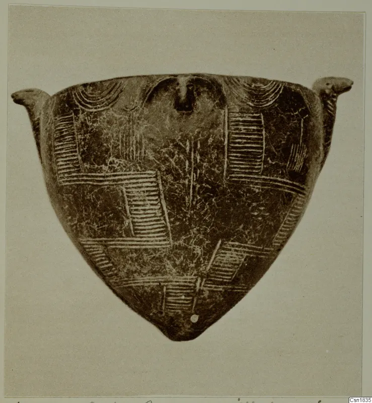 Red Polished I pottery object, triangular in outline, with two small lugs and incised hatched and arc patterns