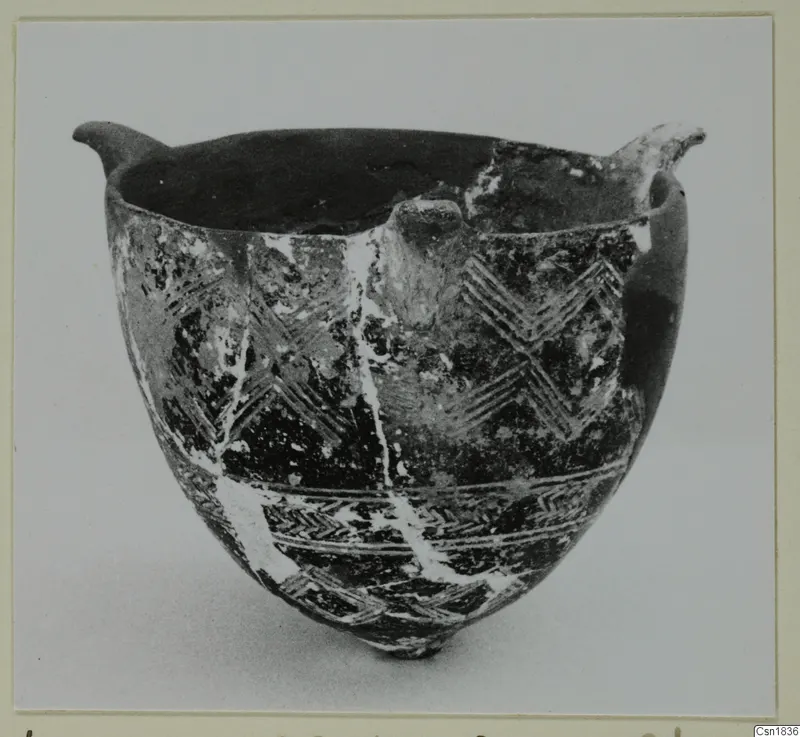 Red Polished I bowl from Vounous, with two small lugs at the rim and incised zigzag bands on the body