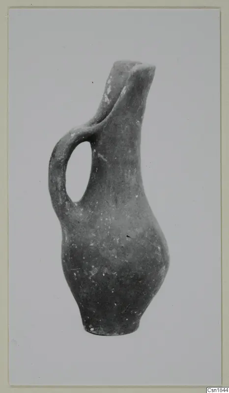 Pottery jug with a single loop handle and pinched spout, Red Polished I (Vounous 120.25), shown upright
