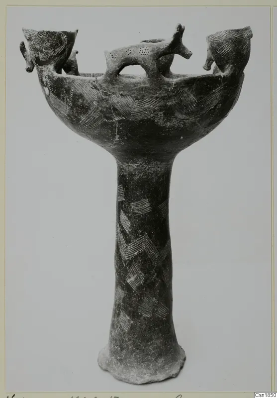 Red Polished I footed vessel from Vounous, with small animal heads on the rim and incised chevron patterns