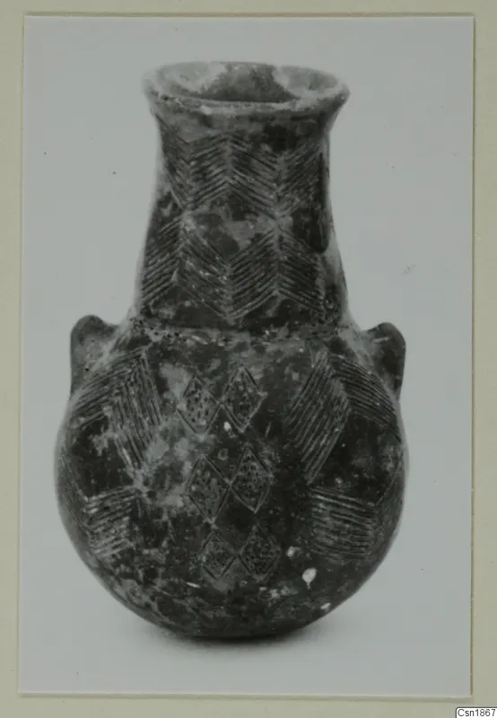 Pottery vessel from Vounous with a flared neck and incised chevron and lozenge decoration