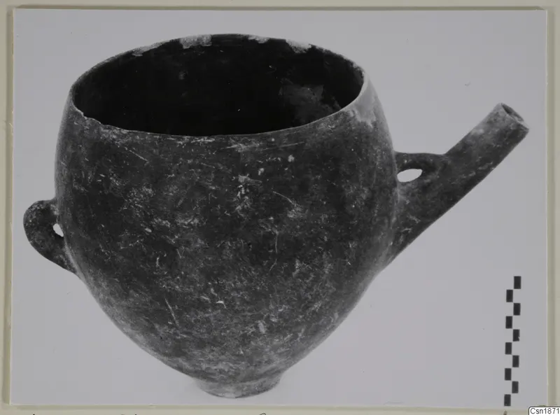 Pottery Red Polished I (Vounous 90.32), a round-bodied vessel with a loop handle and a tubular spout