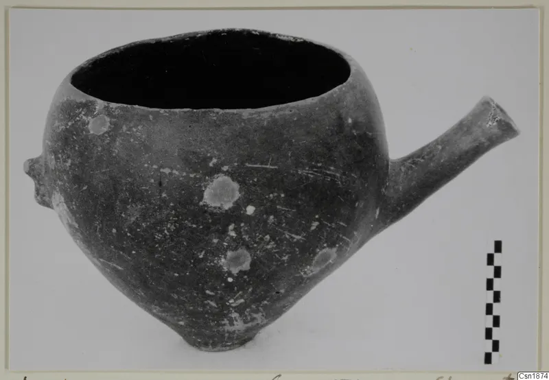 Pottery Red Polished I vessel from Vounous, with a tubular spout projecting to the right and a small lug on the left side