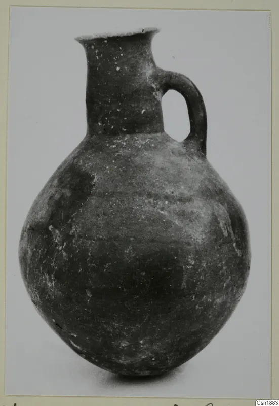 Pottery Red Polished I jug with one handle and a flared rim, from Vounous