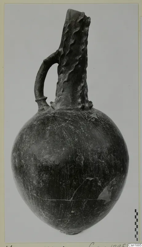 Red Polished I jug from Vounous with a loop handle and a tall, ridged neck