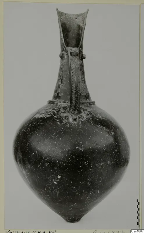 Pottery vessel, Red Polished I Stewart, from Vounous, with a tall flaring neck and a strap handle.