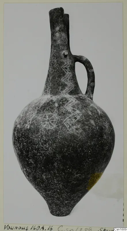 Pottery vessel with a tall neck, one strap handle and incised zigzag and rosette patterns, from Vounous
