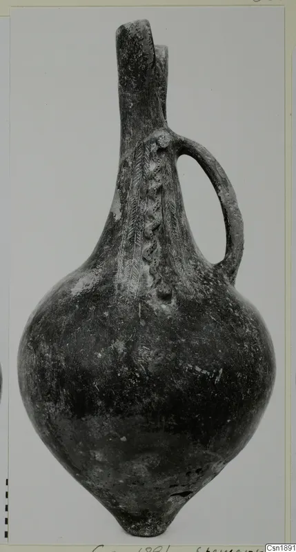 Pottery vessel with a tall neck, single loop handle and incised feather-like bands on the body