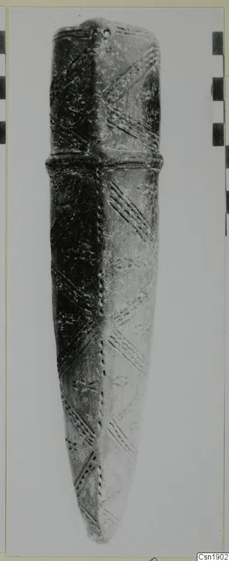 Pottery Red Polished I: elongated object with diagonal incised bands and a raised ridge near the top