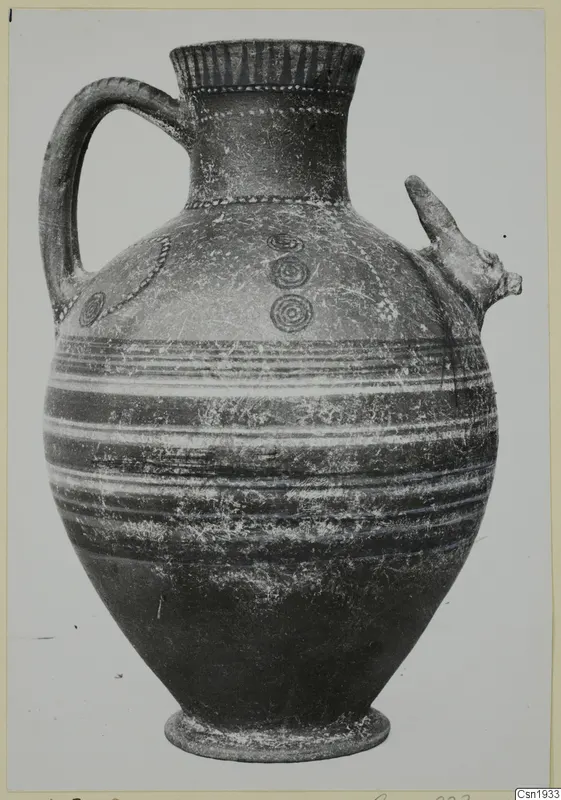 Jug with a strap handle and a modelled animal head on the shoulder, from Marion