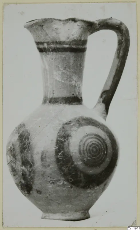 Jug with a single handle and concentric circles painted on its rounded body