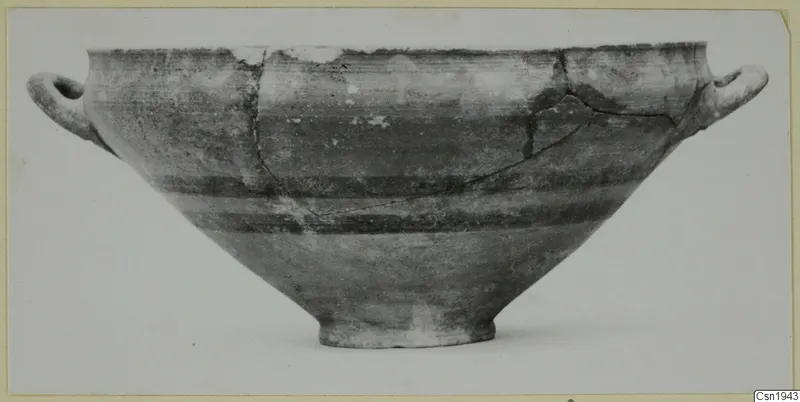 Two-handled bowl with a wide conical body and dark horizontal bands, photographed from the side