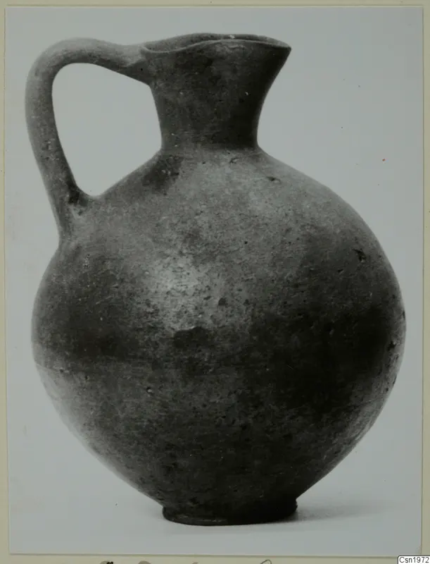 Pottery Black Slip I-VI jug with a single strap handle, from the Kastros tombs at Lapithos