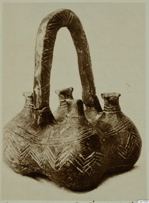 Red Polished III amphora from Vounous with three short necks and a tall arched strap handle