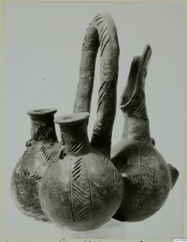 Pottery Red Polished III amphora: three joined vessels with a tall looped handle and incised chevron decoration