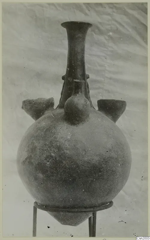 Red Polished II Jug from Vounous: a round-bodied vessel with a tall neck that flares at the rim
