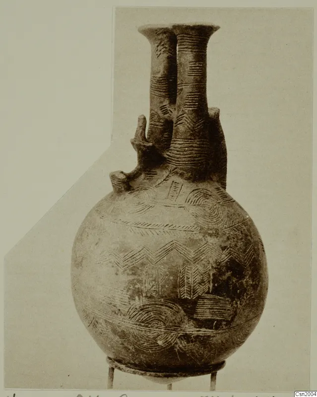 Double-necked jug from Vounous with incised chevron, arc and band decoration, shown on a small stand