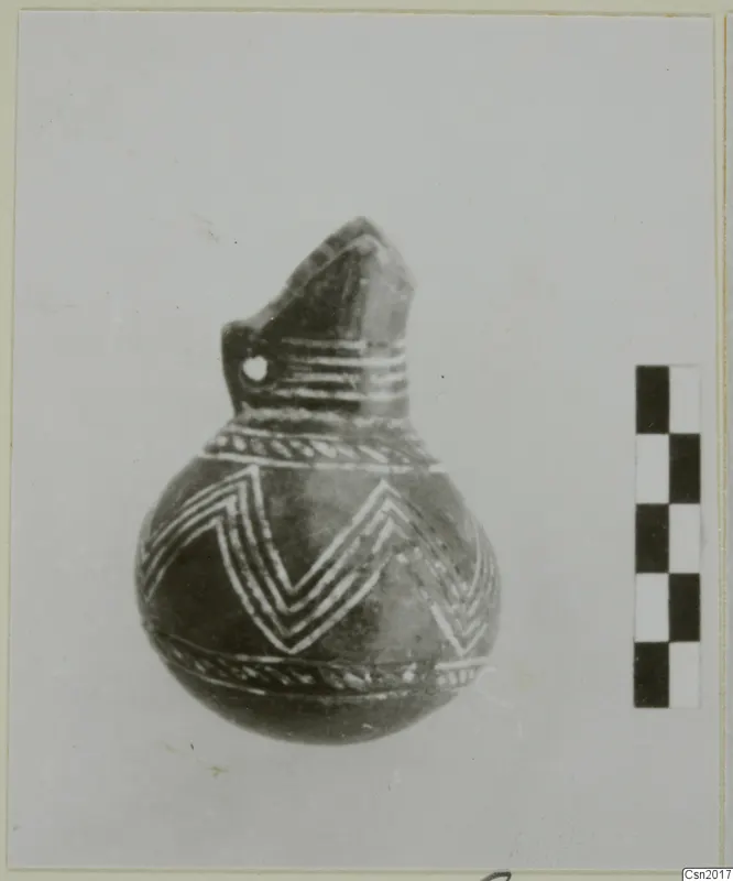 Pottery Red Polished II Bowl: a round-bodied vessel with a beaked neck and white painted chevrons on a dark surface