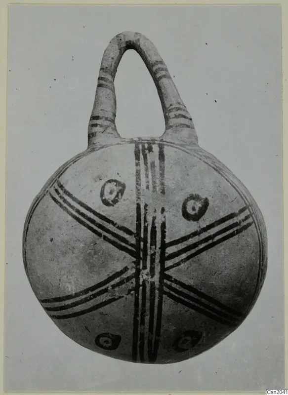 White Painted pottery vessel with a tall loop handle and dark painted bands across the body