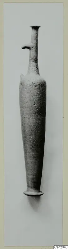 Red Lustrous Ware vessel with a tall narrow neck and a small side projection, standing upright