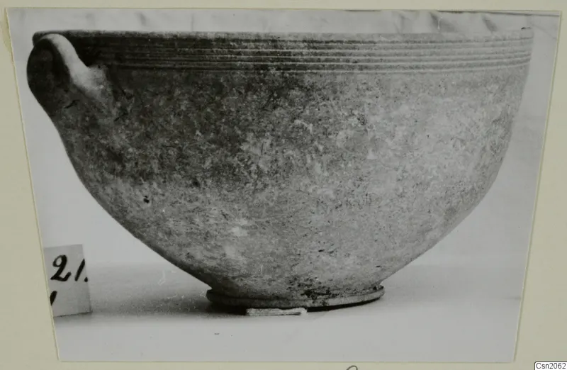 Foreign Red Slip bowl from Amathus with a single handle and ribbed rim, shown in side view