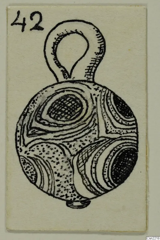 Ink drawing of a round bead or pendant with a loop at the top and concentric ring decoration