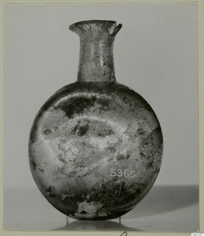 Blown glass flask with a short flared neck and rounded body, shown on a plain grey background.