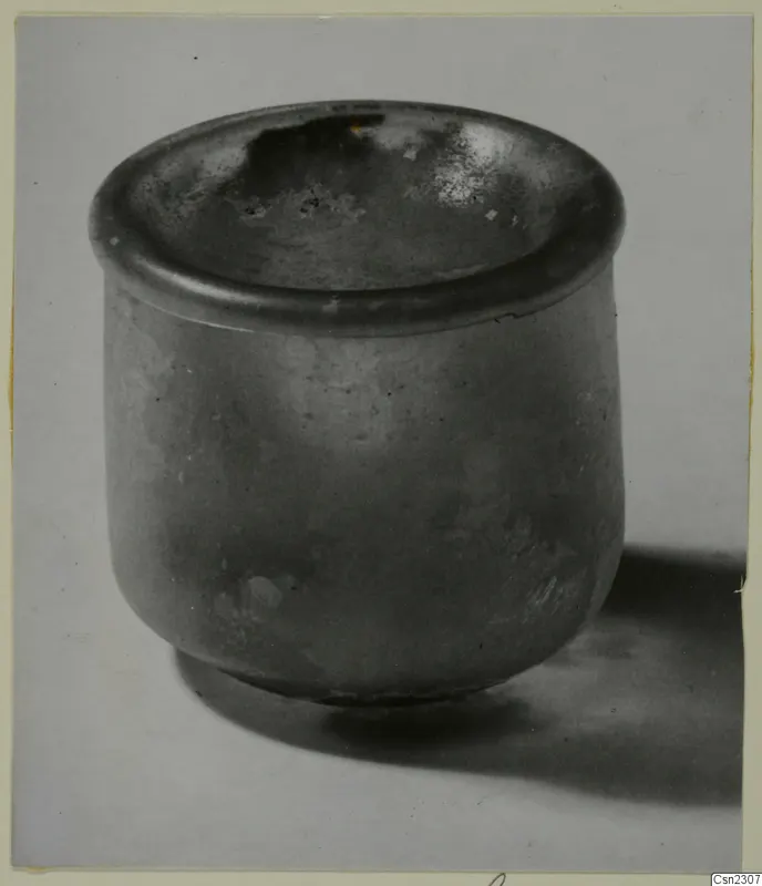 Blown glass jar, a squat cylinder with a wide, flat rim