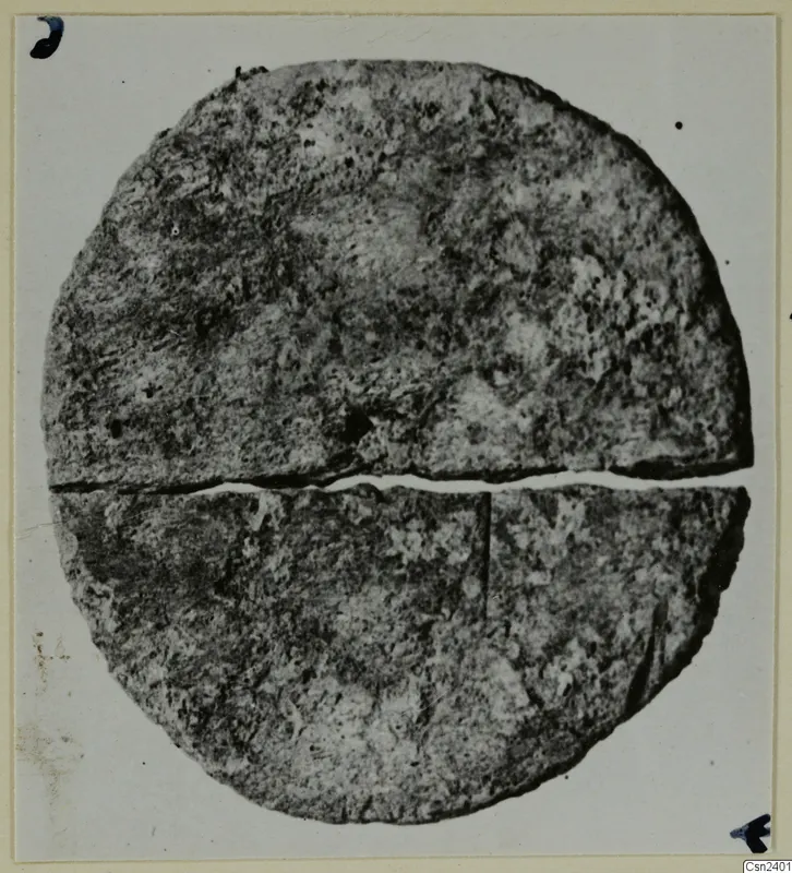 Round, flat find with a crack across its middle, from the Kastros tombs at Lapithos